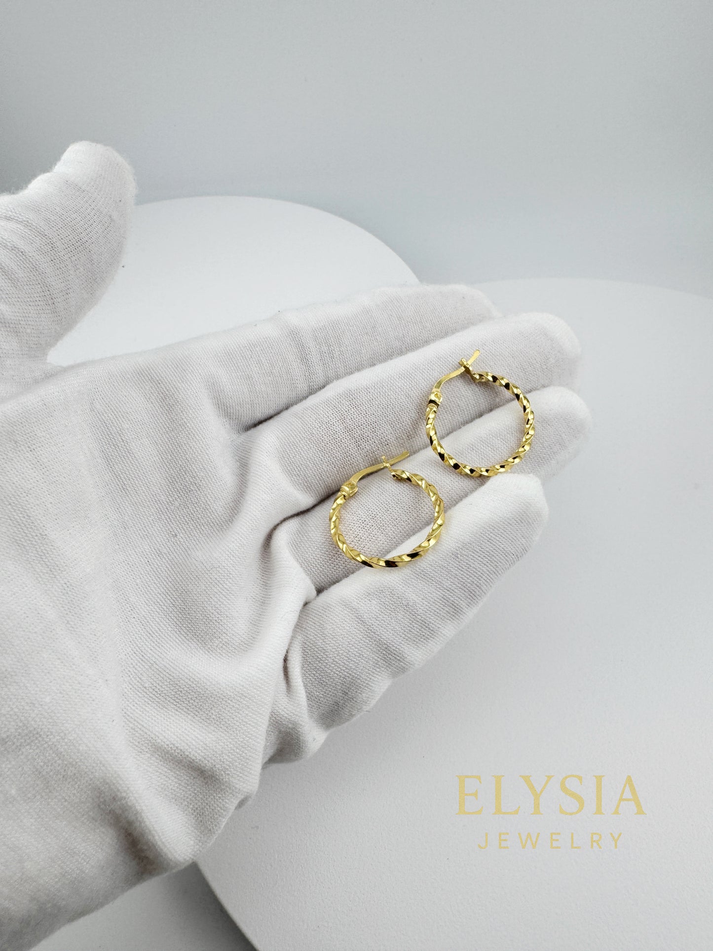 Twisted hoop earrings in 925 silver and gold plating by Elysia Jewelry